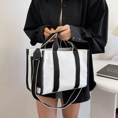 Material principal Bolsos de mano PU GHJ-31 para mujeres con detección de movimiento y diseño a rayas